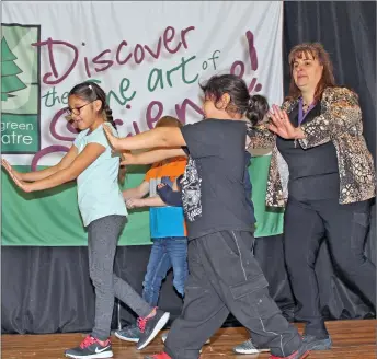  ?? Palliser Schools photo ?? Teacher Bernadette Kirk and students go through a scene during rehearsal for Milo Community School’s production with Evergreen Theatre.