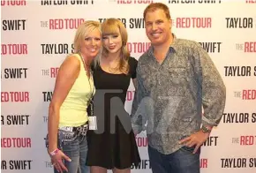  ??  ?? The photo of Shannon Melcher (left) and Mueller (right) with his hand behind Swift (middle) at the Pepsi Center in June 2013.