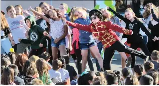  ?? Dan Watson/The Signal (See additional photos at signalscv.com) ?? Zachery Antaloczy, 12, dressed as Michael Jackson, right, joins sixth-graders as they dance to “Thriller” during an assembly at Pico Canyon Elementary School in Stevenson Ranch on Tuesday.