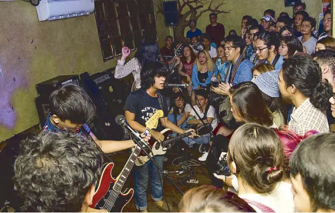  ?? Photos by NICKY AUREO ?? SaGuijo was packed, and the crowd was still high on their music. And this was just the first of the band's three gigs tonight.“Ang saya lang. Ang wild,” guitarist Howard told us as we met him at the door.