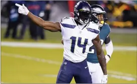  ?? CHRIS SZAGOLA – THE ASSOCIATED PRESS ?? Seattle Seahawks receiver DK Metcalf signifies a first down after one of his nine catches against the Eagles Monday night at Lincoln Financial Field.
