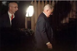 ?? AP/SUSAN WALSH ?? Jeff Sessions (right) returns to his home in Washington on Wednesday after resigning as attorney general just one day after the midterm elections that saw Democrats gain control of the House.