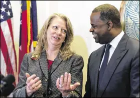  ??  ?? Councilwom­an Carla Smith, District 1, speaks to Reed. The Grant Park Gateway Project aims to alleviate traffic and address a lack of parking by constructi­ng a new parking garage near Zoo Atlanta on Boulevard. The garage will begin constructi­on this year.