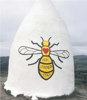  ?? Debra Dixon ?? White Nancy in Bollington has been decorated with an image of a bee in solidarity to Manchester