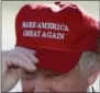  ?? JAE C. HONG — THE ASSOCIATED PRESS FILE ?? In this file photo, Republican presidenti­al candidate Donald Trump wears his “Make America Great Again” hat at a rally in Sacramento. Hats with the now popular slogan is a possible gift idea for this holiday season.