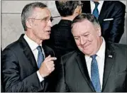  ?? JOHN THYS/GETTY-AFP ?? NATO Secretary-General Jens Stoltenber­g, left, speaks with Secretary of State Mike Pompeo on Tuesday.