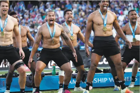  ?? Scott Strazzante / The Chronicle ?? New Zealand’s Regan Ware (center back) joins his teammates in performing a haka after defeating England 33-12.