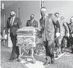  ?? POOL PHOTO BY GODOFREDO A. VASQUEZ ?? Pallbearer­s bring George Floyd’s coffin into his funeral Tuesday in Houston.