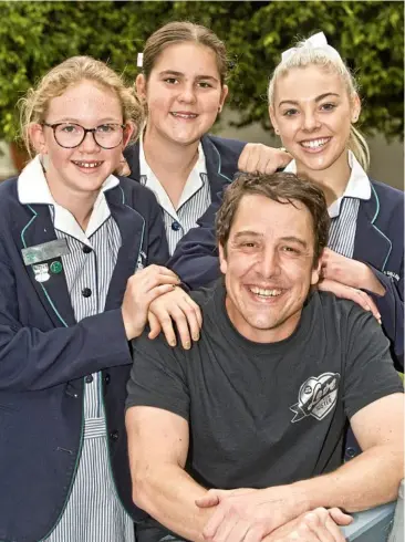  ?? Photo: Nev Madsen ?? FIGHTING CANCER: St Ursula’s College students (from left) Eve Tague, Breanna Simmons and Skyla White helped raise more than $1000 for Samuel Johnson’s Love Your Sister campaign.