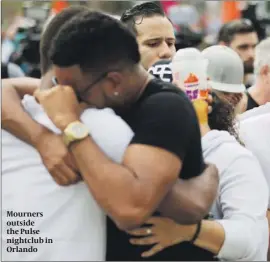  ?? PHOTO: AP ?? Mourners outside the Pulse nightclub in Orlando