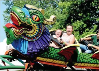  ?? TANIA BARRICKLO-DAILY FREEMAN, FILE ?? Sebastian Ziegler, then 3, son of Lauren Simmons of Ellenville rides “the Orient” roller coaster with his aunt Aleya Steinhilbe­r, also of Ellenville, while visiting the Ulster County Fair in New Paltz in 2016.