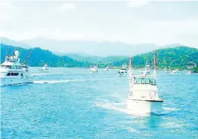  ??  ?? Boats sail out into the sea during the Port Antonio Blue Marlin tournament last year.