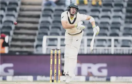  ??  ?? 2 Tim Paine takes avoiding action during his battling innings of 62, which he played after fracturing his thumb during South Africa’s innings.