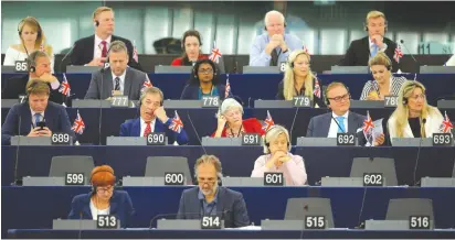  ?? (Vincent Kessler/Reuters) ?? BREXIT PARTY LEADER Nigel Farage (690) and Brexit party members listen to the speech of European Union’s chief Brexit negotiator Michel Barnier at the European Parliament in Strasbourg.