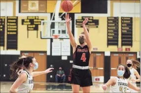  ?? Christian Abraham / Hearst Connecticu­t Media ?? Ridgefied’s Katie Flynn (4) releases a jump shot against Trumbull on Feb. 10.