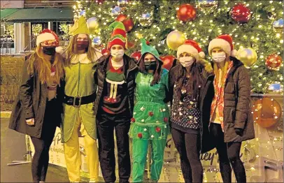  ?? PHOTO PROVIDED BY AMY REDIGER ?? Andrew girls volleyball players pose the night they shot a video for the Illinois High School Associatio­n’s first Holiday TikTok Challenge, using the Mariah Carey song “All I Want For Christmas”.