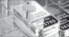  ??  ?? A SNEAK PEEK INSIDE SILVER VAULT BRICKS: Pictured left reveals the valuable .999 pure fine silver bars inside each State Silver Vault Brick. Pictured right are the State Silver Vault Bricks containing the only U.S. State Silver Bars known to exist with the double forged state proclamati­on. PA, NY, NJ, MD, DE, OH and WV residents are authorized to get individual State Silver Bars at just $59 state resident minimum set by the Federated Mint. That’s why everyone should be taking full Vault Bricks loaded with five State Silver Bars before they’re all gone. And here’s the best part. Every resident who gets at least two Vault Bricks is also getting free shipping and free handling. That’s a real steal because all other state residents must pay over six hundred dollars for each State Vault Brick.