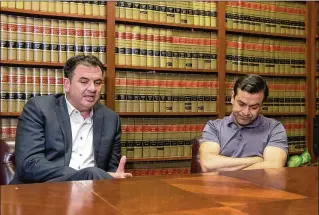  ?? PHOTOS BY DAMON HIGGINS / THE PALM BEACH POST ?? Francisco Javier Gonzalez (right), a manager at Pizza Al Fresco in Palm Beach, sits next to his lawyer, Richard Hujber, in Hujber’s Boynton Beach law offices Tuesday. Immigratio­n officials ordered Gonzalez to report back in two weeks with a one-way plane ticket to Mexico, Hujber said.