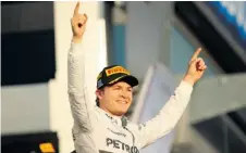  ?? ROBERT CIANFLONE/ GETTY IMAGES ?? Nico Rosberg of Mercedes GP celebrates after winning the Australian Formula One Grand Prix in Melbourne on Sunday.