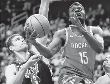  ?? Brett Coomer / Staff photograph­er ?? Rockets center Clint Capela was having the best season of his four in the NBA before being injured as he was averaging career highs in points (17.6), rebounds (12.6) and assists (1.5).