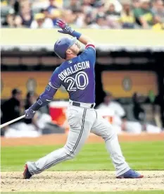  ?? EZRA SHAW/GETTY IMAGES ?? Josh Donaldson hits a two-run home run in the tenth inning against the Oakland Athletics on Wednesday in Oakland, Calif.