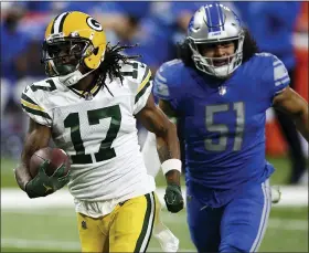  ?? ASSOCIATED PRESS FILE PHOTO ?? Green Bay Packers receiver Davante Adams. left, pulls away from Detroit Lions linebacker Jahlani Tavai for a touchdown during Detroit’s loss last month. Tavai has struggled since being selected in the second round of the 2019 draft by fomer Lions GM Bob Quinn.