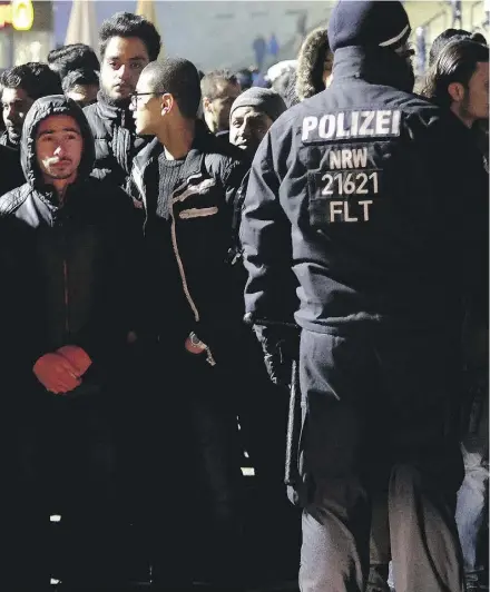  ?? ATRIK STOLLARZ / AFP / GETTY IMAGES ?? More than 1,700 police officers were on patrol at Cologne’s main train station on New Year’s Eve.