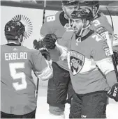  ?? JIM RASSOL/STAFF PHOTOGRAPH­ER ?? With his 29th and 30th goals Saturday night, center Vincent Trocheck, right, became the eighth Panther to have a 30-goal season.