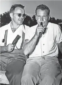  ?? THE COMMERCIAL APPEAL FILES ?? The perfect tone of Tennessee’s champion duck caller, Dewey Lloyd, right, brings a smile of admiration to the face of third-place Clyde A. Harbin of Whitehaven. Lloyd, of Trenton, Tennessee, won the title at the West Tennessee Sportsmen’s Associatio­n rally in August 1951.