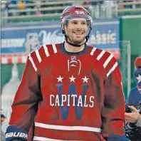  ?? AP PHOTO ?? Washington Capitals right wing Troy Brouwer (20) smiles as he leaves the rink after the Winter Classic outdoor NHL game against the Chicago Blackhawks at Nationals Park in Washington on Jan. 1, 2015.