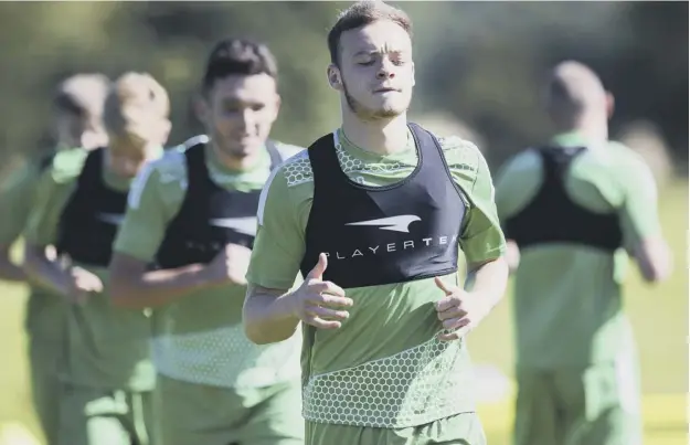  ??  ?? 0 Winger Brandon Barker, front, trains with his new team-mates at East Mains yesterday after joining Hibs on a season-long loan deal from Manchester City.