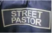  ?? MATT CARDY/GETTY IMAGES ?? Britain’s Christian street pastors wear distinctiv­e blue jackets and baseball caps.