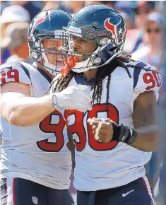  ?? AP FILE ?? Houston’s J.J. Watt, left, and Jadeveon Clowney are key members of a formidable defense that has helped the Texans win nine straight games.