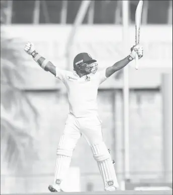  ??  ?? Batsman Kusal Perera celebrates after leading Sri Lanka to victory on Tuesday’s penultimat­e day of the historic day/night Test. (Photo courtesy CWI Media)