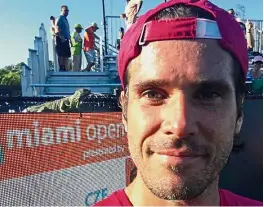  ??  ?? Holding court: Tommy Haas takes a selfie with an iguana that showed up on the scoreboard during his match against Jiri Vesely in the Miami Open on Wednesday. — AP