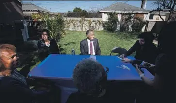  ?? Photograph­s by Francine Orr Los Angeles Times ?? HUD SECRETARY Ben Carson, middle, sits down for an interview with Times reporter Benjamin Oreskes, right, on Thursday. Carson called homelessne­ss “too big of a problem for anybody to handle by themselves.”