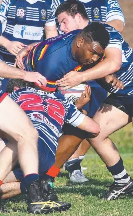  ??  ?? North Ward’s Jon Salee is tackled. Picture: Evan Morgan