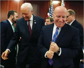  ?? (Joshua Roberts/Reuters) ?? SENATE FINANCE COMMITTEE Chairman Orrin Hatch (left) greets House Ways and Means Committee Chairman Kevin Brady as the House-Senate conferees hold a meeting on the ‘Tax Cuts and Jobs Act’ in Washington last week.