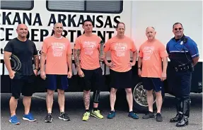  ?? Staff photo by Mallory Wyatt ?? Texarkana Arkansas Police Department officers prepare for the southwest leg of the Law Enforcemen­t Torch Run on Monday at Walmart on Arkansas Boulevard. Pictured, from left, are Les Munn, Kelly Pilgreen, Daniel Thomas, Jeff Gladden, Alan Fincher and Chris Estes.