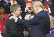  ?? Keith Srakocic / Associated Press ?? Candidate Rick Saccone appears with President Trump at a rally Saturday in Moon Township, Pa.