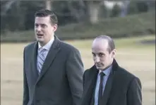  ?? Carolyn Kaster/Associated Press ?? White House staff secretary Rob Porter, left, walks with senior adviser Stephen Miller on Monday across the South Lawn of the White House.