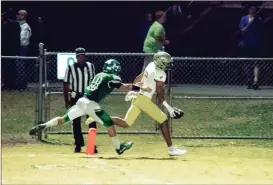  ?? TIM GODBEE / For the Calhoun Times ?? Calhoun’s Luke Moseley (5) stretches over the goal line past a Murray County defender for a touchdown on Friday. Moseley had touchdown catches of 71 and 35 yards on the night.