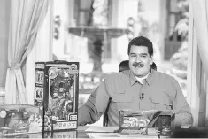  ??  ?? Venezuela’s President Nicolas Maduro speaks next to children toys during his weekly broadcast ‘En contacto con Maduro’ (In contact with Maduro) at Miraflores Palace in Caracas, Venezuela . — Miraflores Palace/Handout via Reuters photo