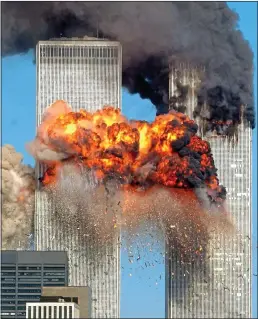  ??  ?? mass murder: United Airlines Flight 175 hits the World Trade Center