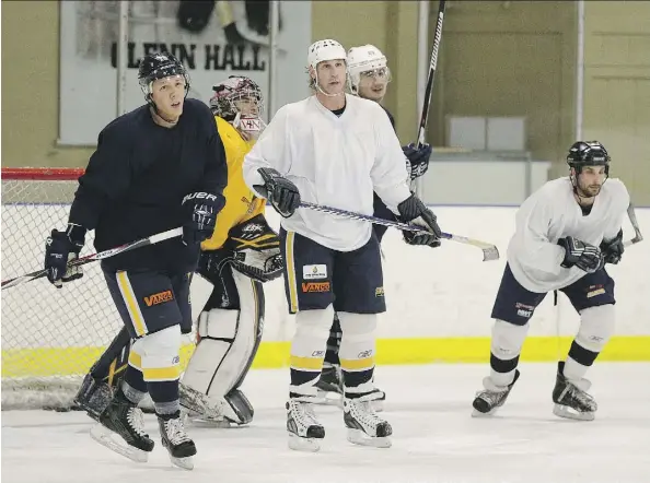  ?? LARRY WONG ?? Ryan Smyth, middle, skates during a team practice with the Stony Plain Eagles earlier this season. He may not play in the Chinook Hockey League for the rest of this season due to a concussion. “People ask why I’m still playing,” Smyth says. “I have a...