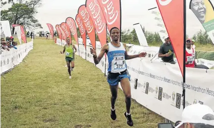  ?? / PHOTOS / THULANI MBELE ?? Heroes Marathon winner Nkosikhona Mhlakwana of Howick, KZN, surges for the finish line ahead of second placed Kebede Aberra from Ethiopia.