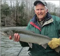  ?? ?? Leo Maloney catching a steelhead on the Salmon River.