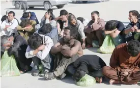  ??  ?? KABUL, Afghanista­n: Afghan drug addicts wait for registrati­on at a rehabilita­tion center during a campaign to help drug users in Kabul.