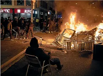  ?? AP ?? A barricade burns during a protest in Barcelona yesterday condemning the arrest and jailing of rapper Pablo Hasel.