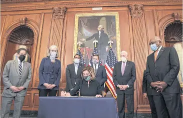  ?? NYT ?? Speaker of the House Nancy Pelosi signs the article of impeachmen­t at the Capitol in Washington after the House impeached President Trump for inciting a violent insurrecti­on against the United States government.